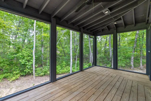 a view of a room that has a large window