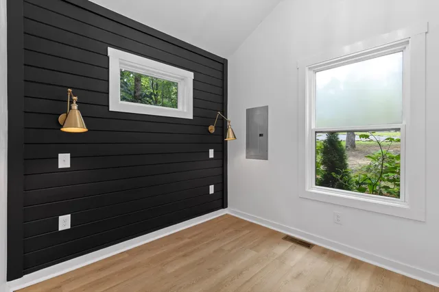 a view of room with window and hardwood floor