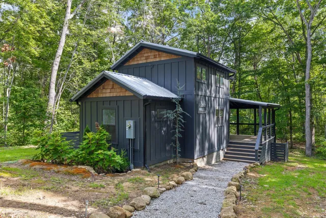 a front view of a house with garden