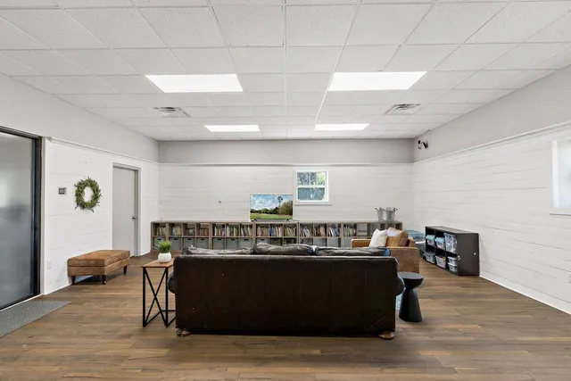 a view of a room with wooden floor