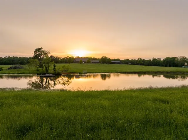 a view of a lake with a garden