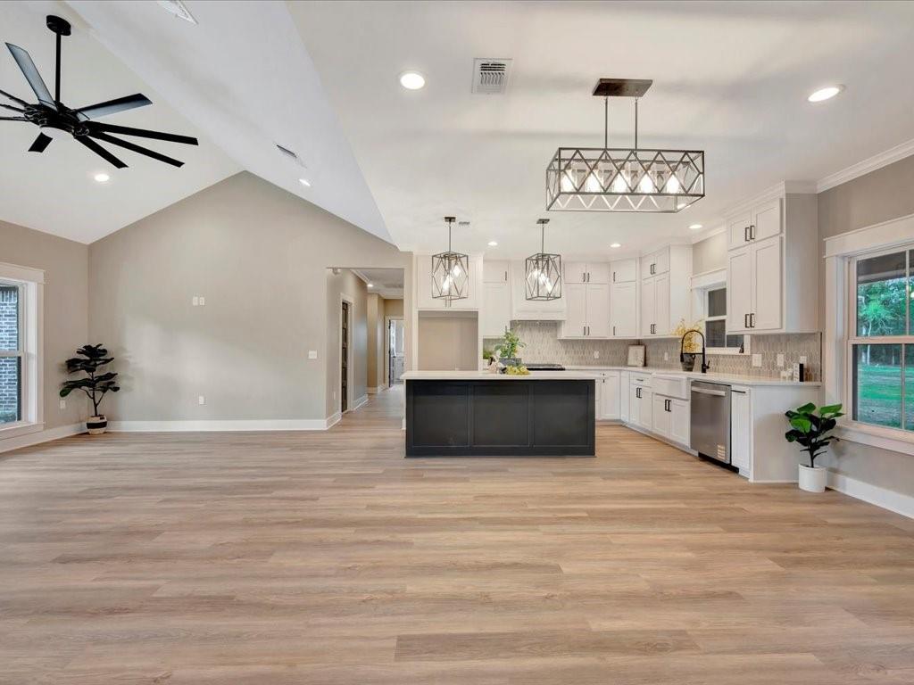 537 C C Road Diboll, TX 75941 - Photo 18 of 37 a view of a kitchen with cabinets stainless steel appliances a sink and a chandelier