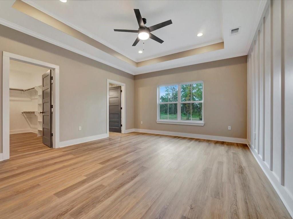 537 C C Road Diboll, TX 75941 - Photo 21 of 37 a view of an empty room with wooden floor and a window