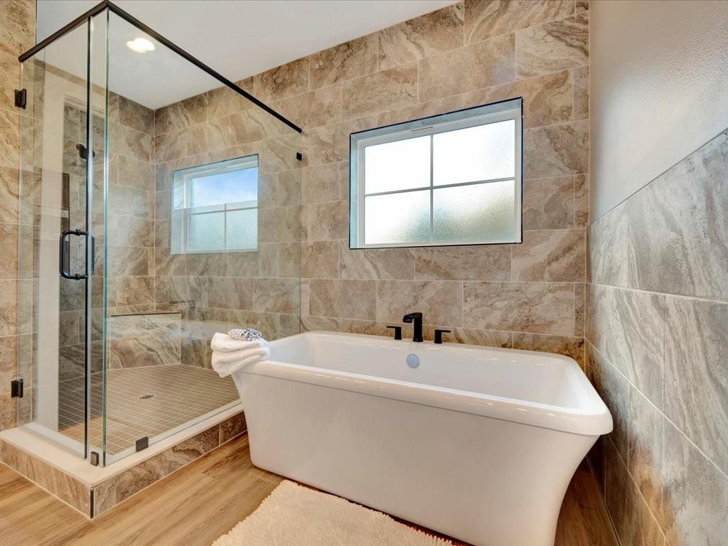 537 C C Road Diboll, TX 75941 - Photo 25 of 37 a bathroom with a bathtub and shower