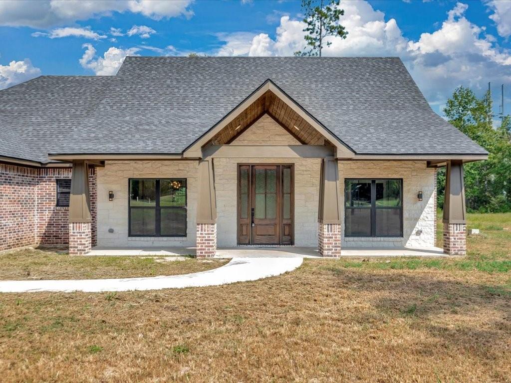 537 C C Road Diboll, TX 75941 - Photo 5 of 37 a front view of a house with a porch