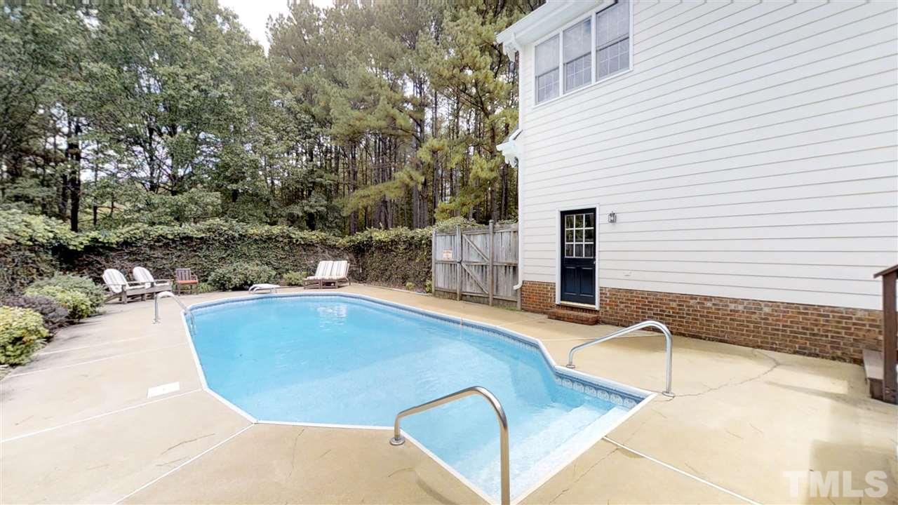 2704 Vestry Way Raleigh, NC 27613 - Photo 3 of 25 a view of a swimming pool with a patio