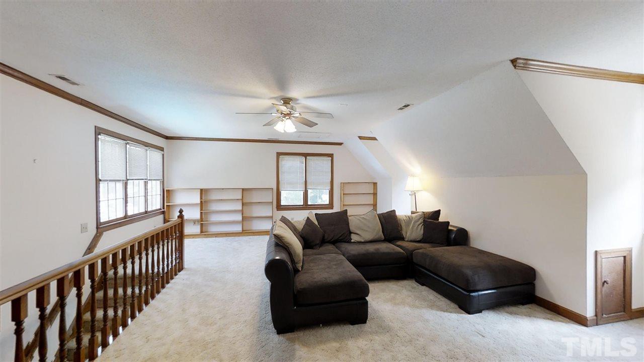 2704 Vestry Way Raleigh, NC 27613 - Photo 21 of 25 a living room with furniture and a window
