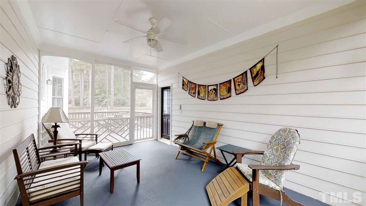2704 Vestry Way Raleigh, NC 27613 - Photo 24 of 25 a living room with furniture and a floor to ceiling window
