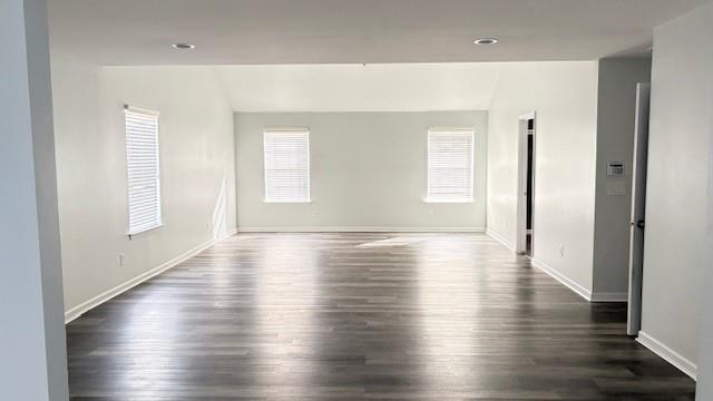 201 Overlook Court Canton, GA 30115 - Photo 13 of 22 an empty room with wooden floor and windows with curtains