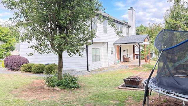 201 Overlook Court Canton, GA 30115 - Photo 18 of 22 a view of a house with backyard and a tree