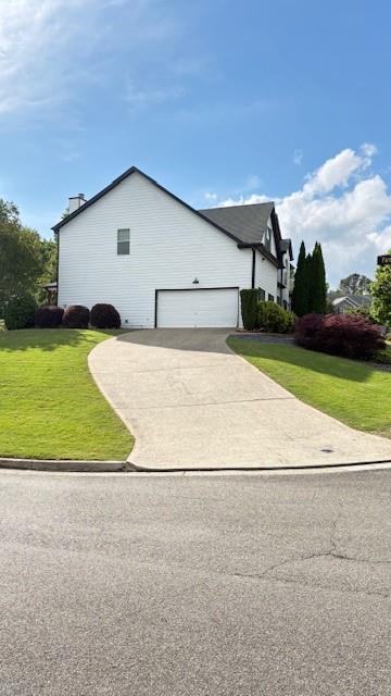 201 Overlook Court Canton, GA 30115 - Photo 21 of 22 a view of backyard of house and car parked