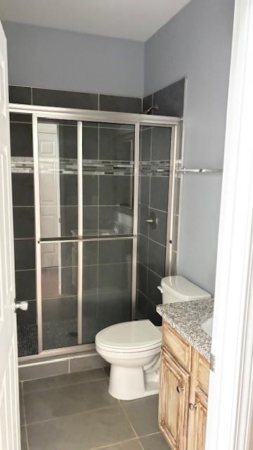 201 Overlook Court Canton, GA 30115 - Photo 7 of 22 a bathroom with a toilet and a shower