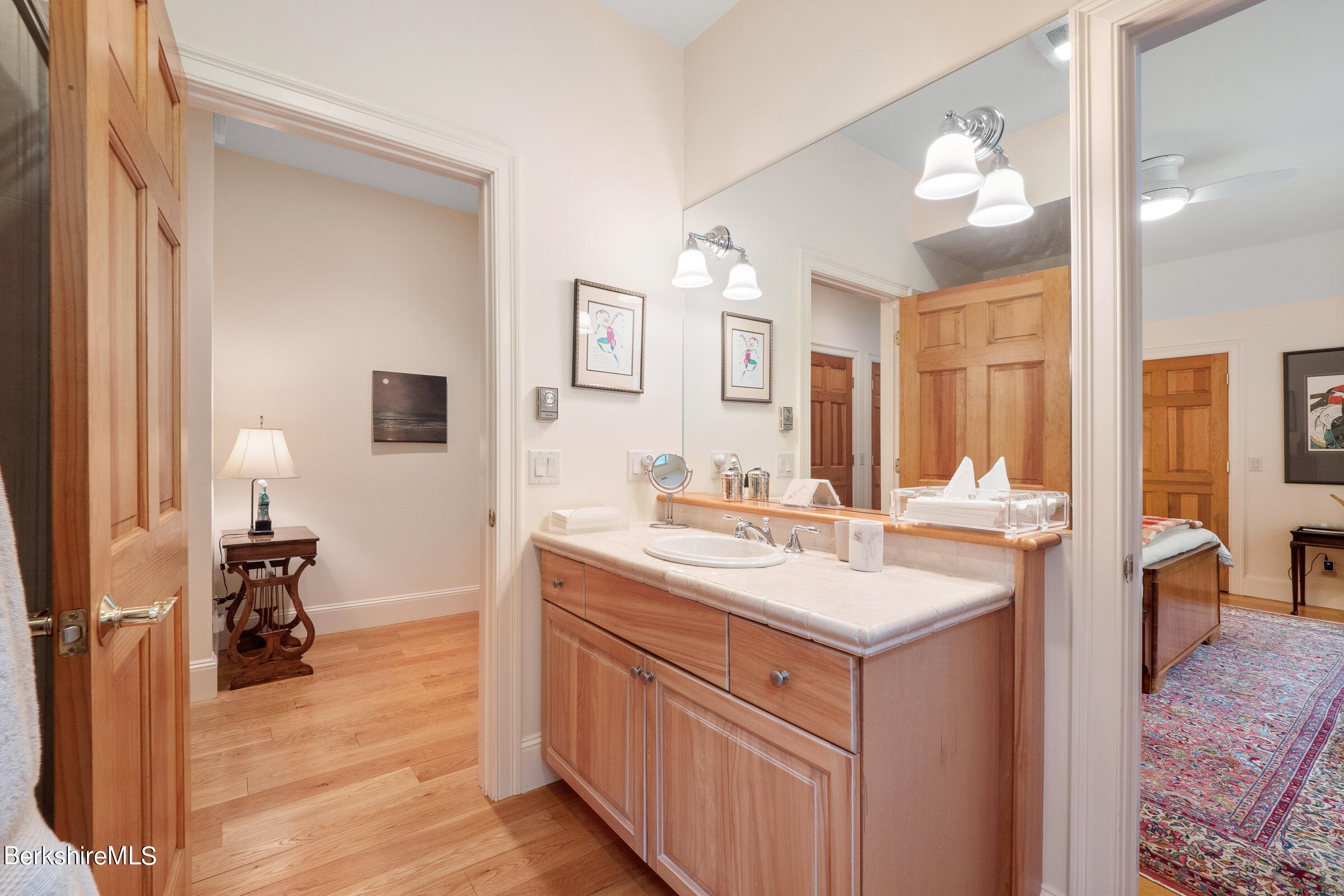 9 East Mountain Road Great Barrington, MA 01230 - Photo 29 of 45 a bathroom with a sink a toilet and a large mirror