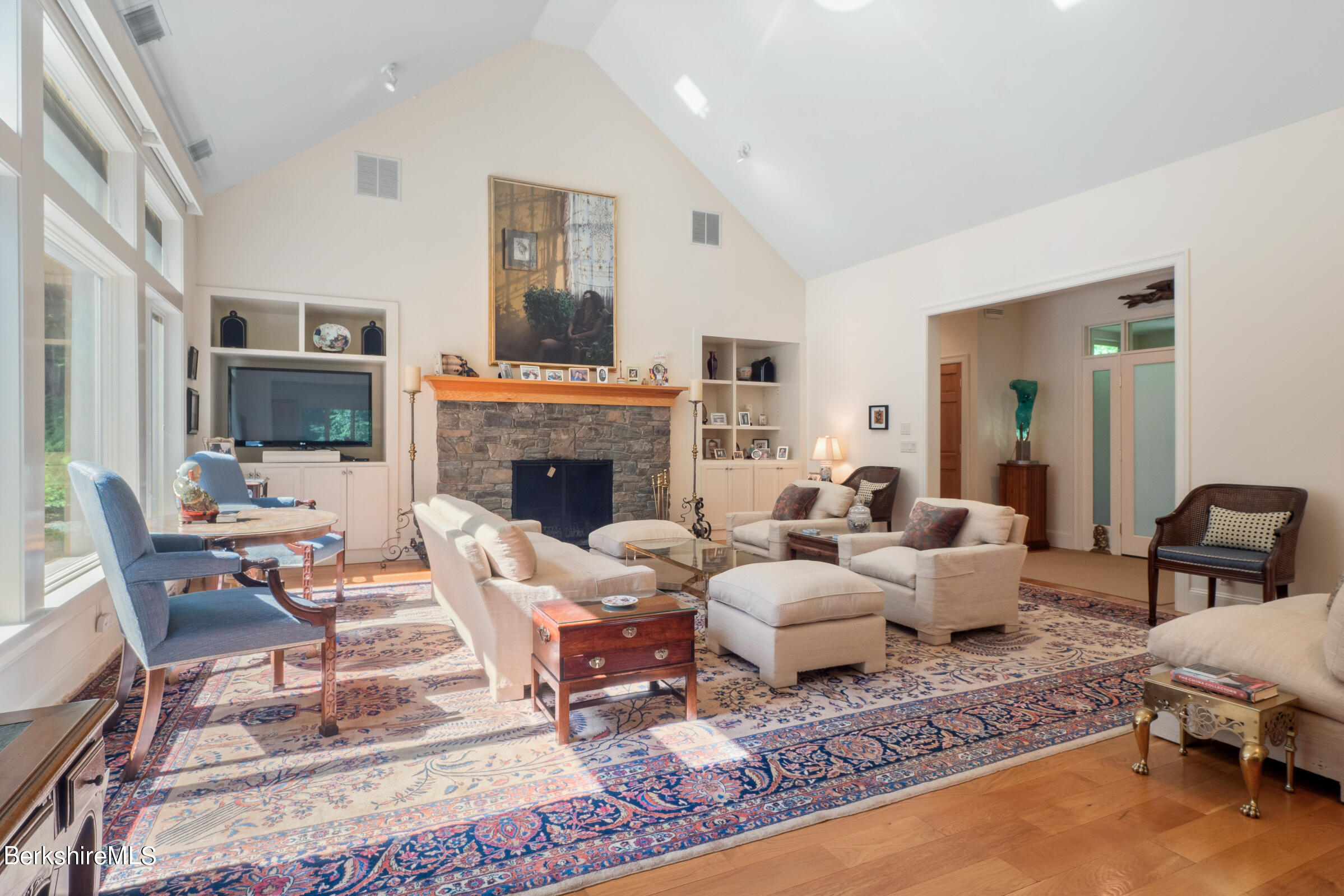 9 East Mountain Road Great Barrington, MA 01230 - Photo 9 of 45 a living room with furniture fireplace and a flat screen tv