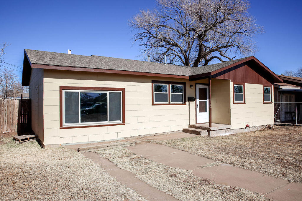 532 54th Street Lubbock, TX 79404 - Photo 2 of 19 a front view of a house with a yard and garage