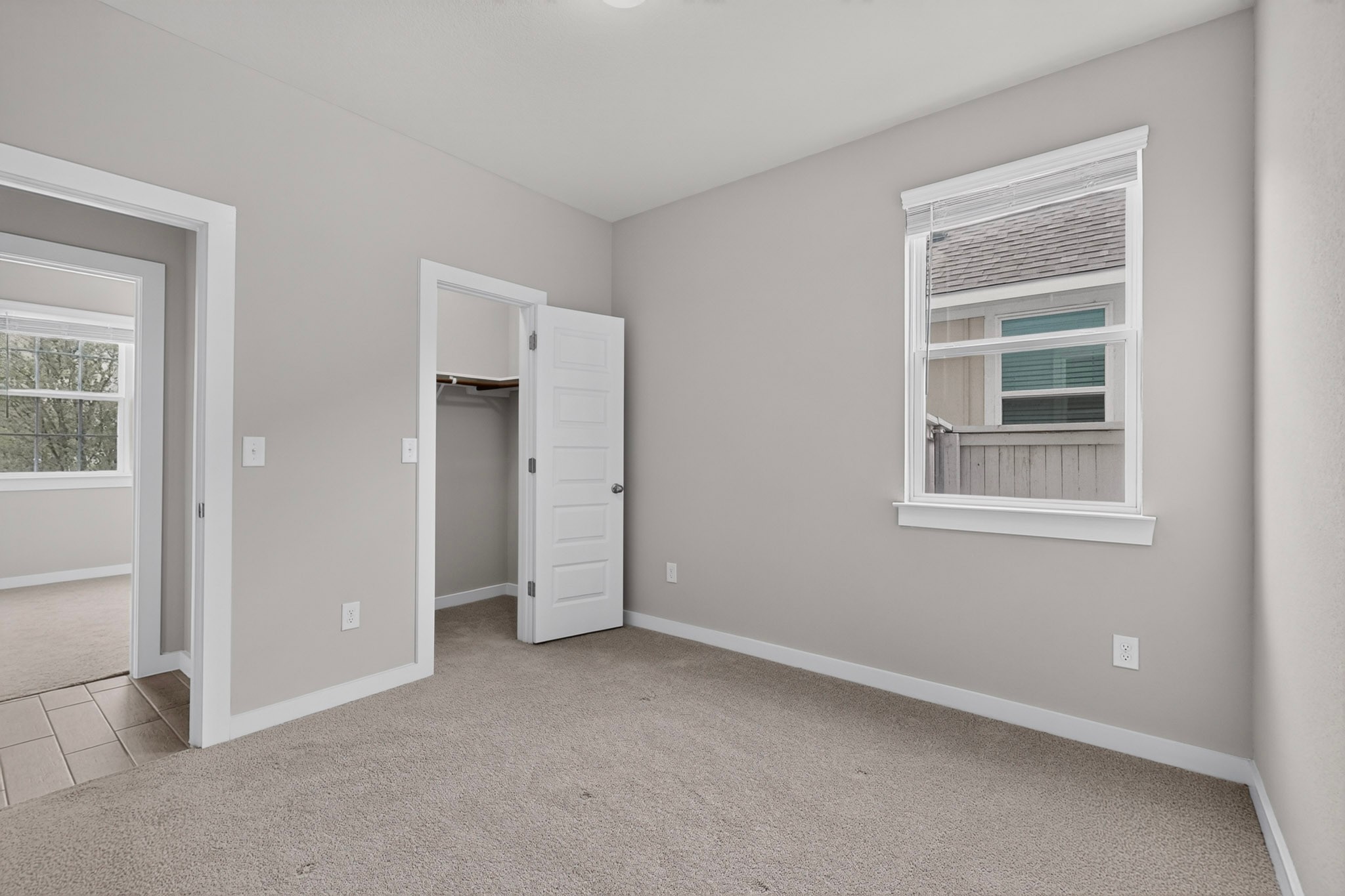 116 Appleberry Lane Elgin, TX 78621 - Photo 19 of 35 A well-lit bedroom provides comfortable living with soft carpeting and a spacious closet.