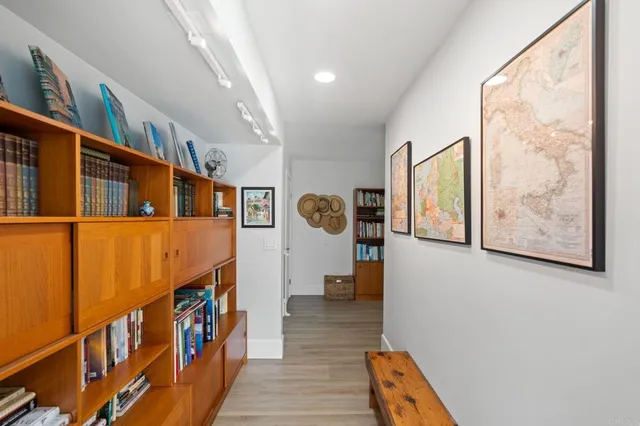a bathroom with a bathtub sink and mirror