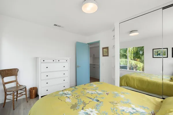 a bedroom with a bed and a view of bedroom