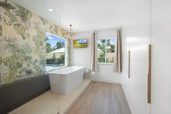 a bathroom with a bathtub and shower