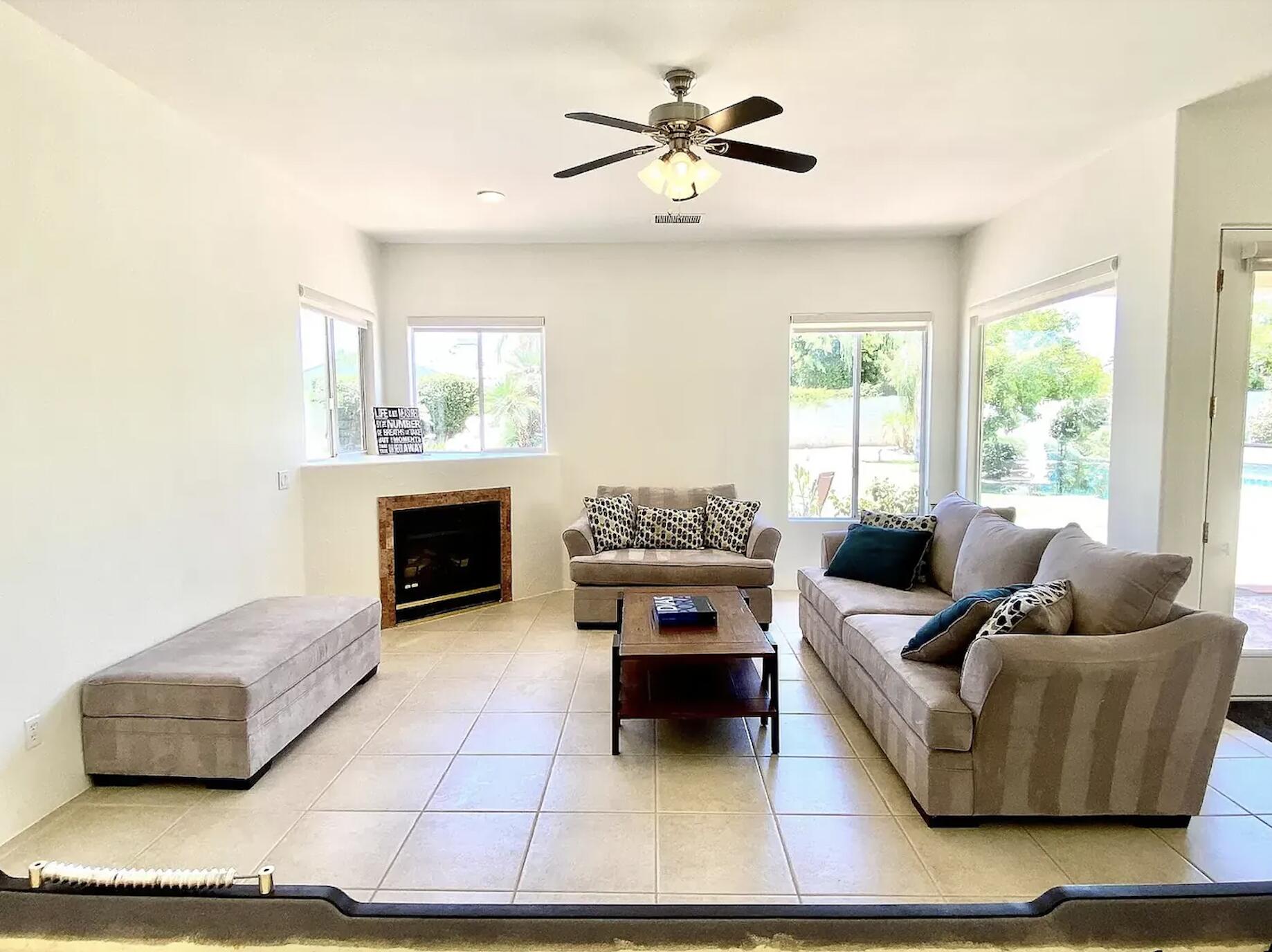 5 Victoria Falls Drive Rancho Mirage, CA 92270 - Photo 20 of 26 a living room with furniture and a fireplace