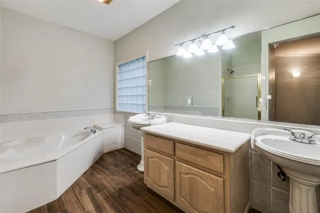 a view of room with window and hardwood floor