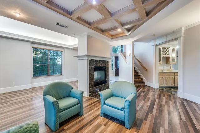 wooden floor in an empty room with a fireplace