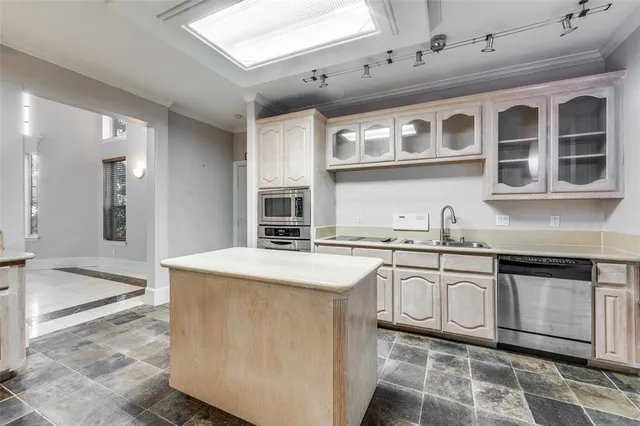 a kitchen that has a cabinets and a stove