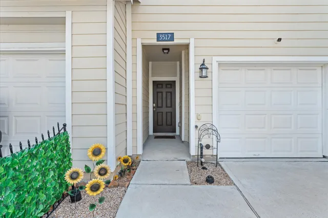 a front view of a house with outdoor seating