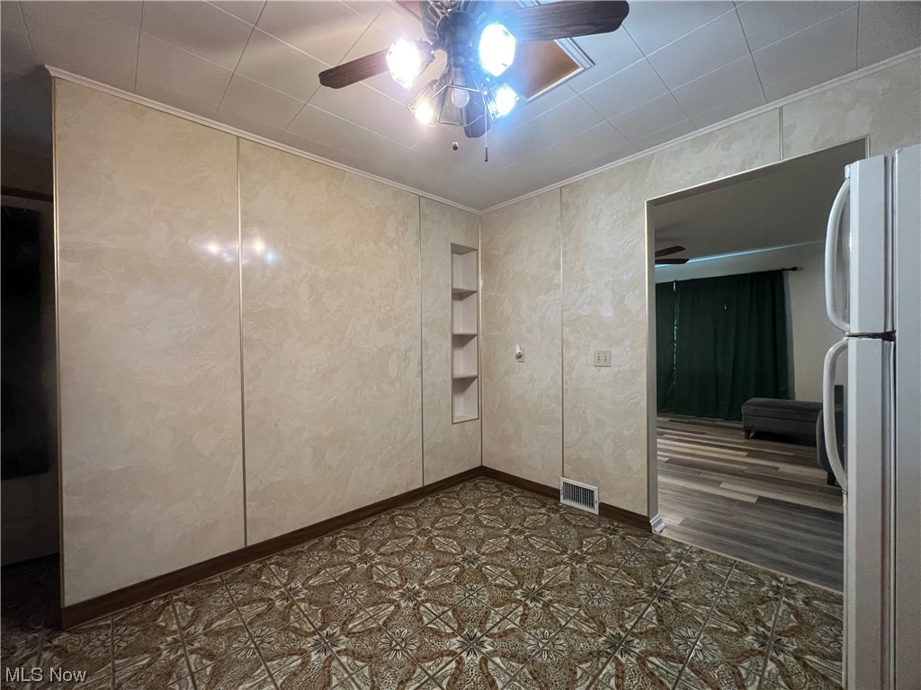229 Hilliard Road Elyria, OH 44035 - Photo 16 of 28 Basement spare room featuring ornamental molding and ceiling fan