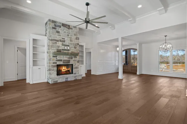 a kitchen with granite countertop a sink cabinets and stainless steel appliances