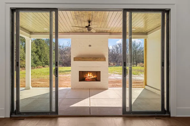 a kitchen with stainless steel appliances white cabinets and a stove top oven