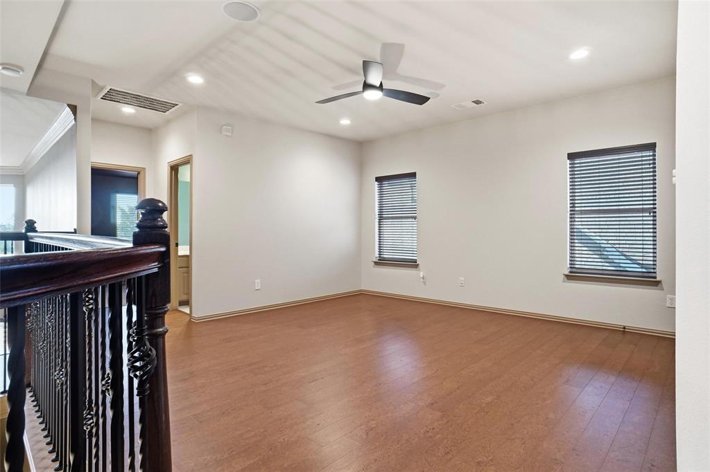 4840 Exposition Way Fort Worth, TX 76244 - Photo 11 of 40 a view of an empty room with a fireplace and wooden floor