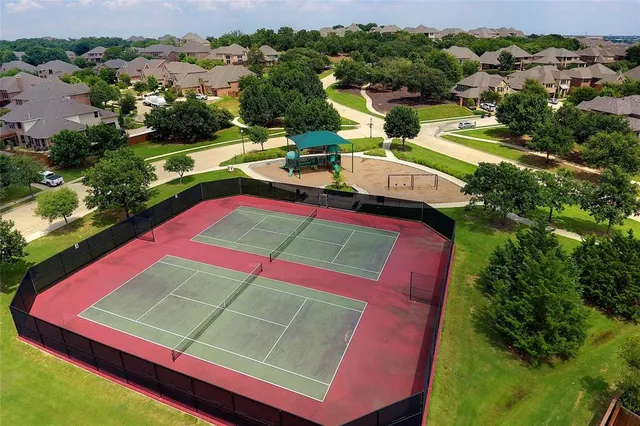 an aerial view of a pool yard and mountain view