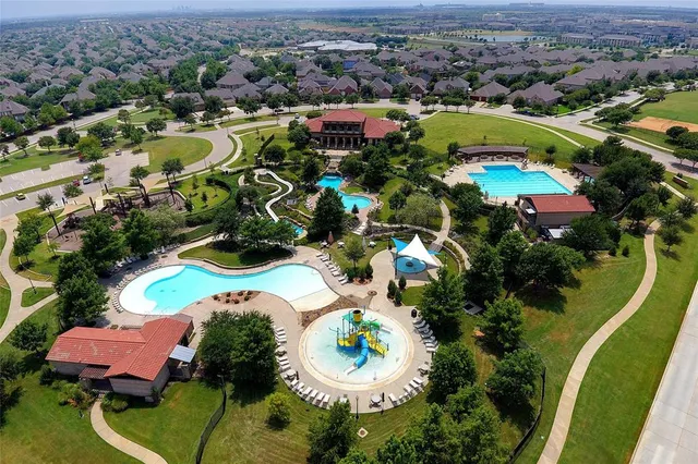 an aerial view of residential houses with outdoor space