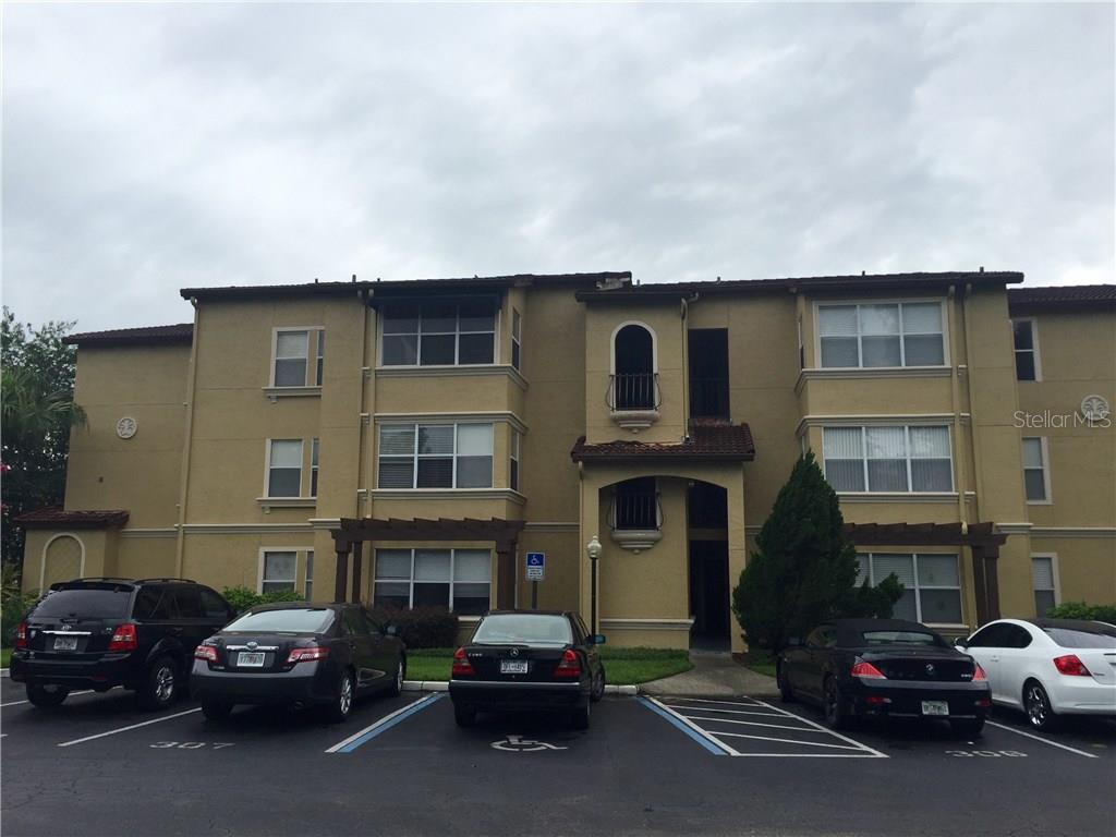5144 Conroy Road, Unit 1033 Orlando, FL 32811 - Photo 1 of 1 a car parked in front of a building