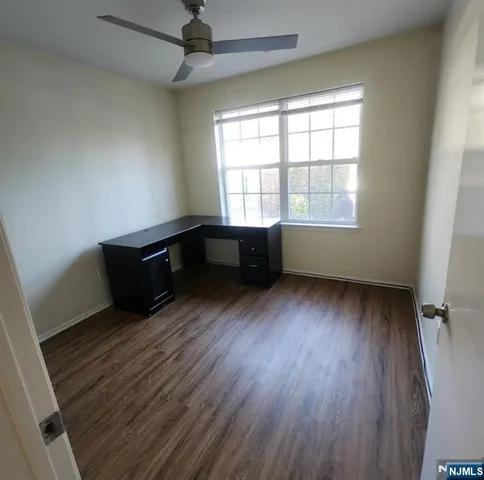 a room with window and a wooden floor