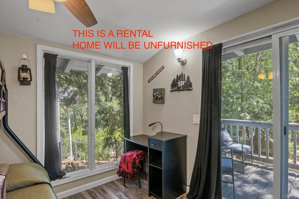 23882 Springwater Road Crestline, CA 92325 - Photo 20 of 39 a view of a room with furniture and a window