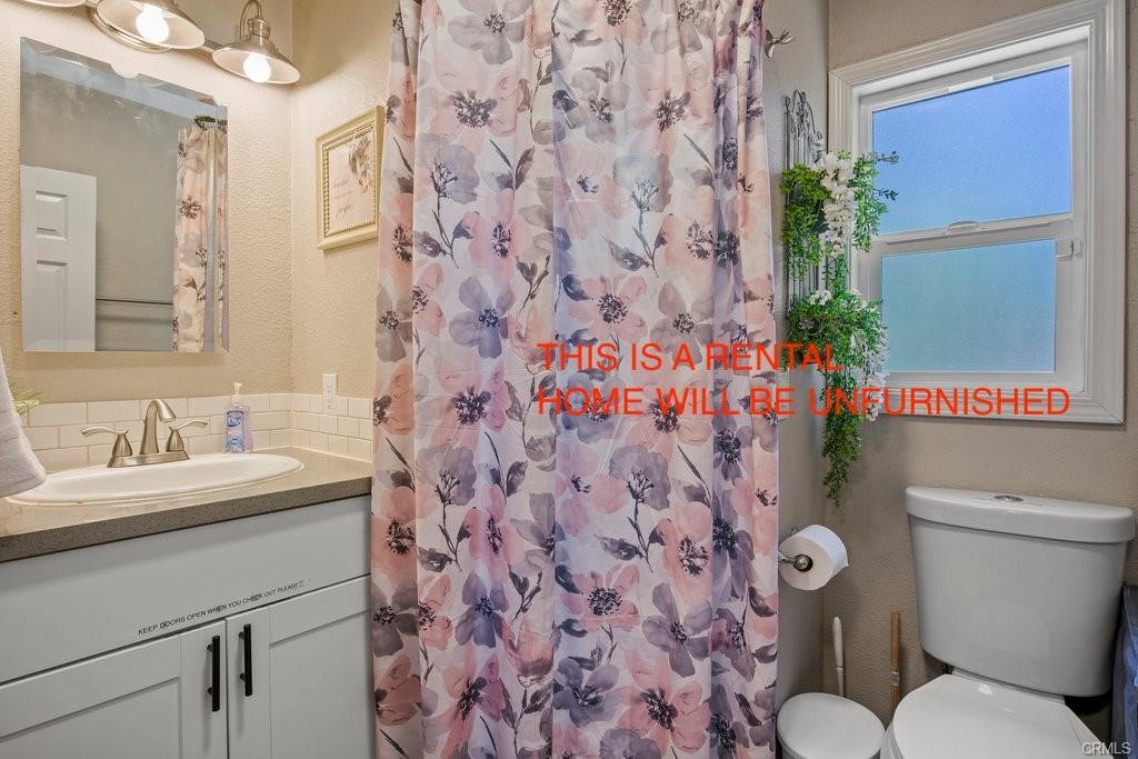 23882 Springwater Road Crestline, CA 92325 - Photo 24 of 39 a bathroom with a sink and a toilet