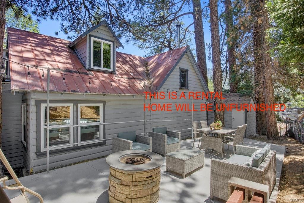 23882 Springwater Road Crestline, CA 92325 - Photo 26 of 39 a view of a chairs and table in the patio