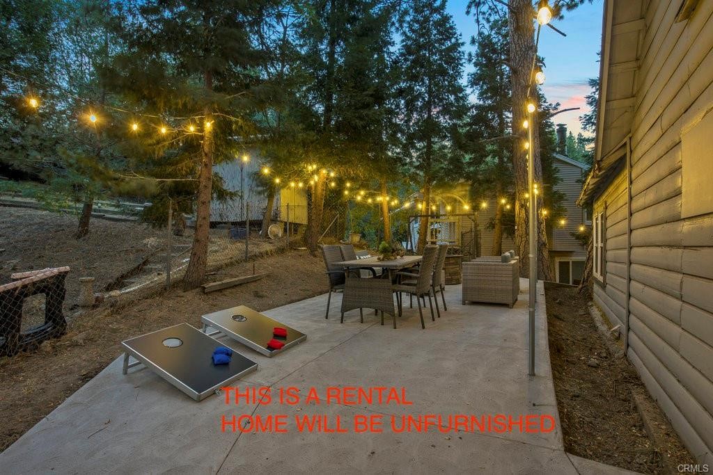 23882 Springwater Road Crestline, CA 92325 - Photo 31 of 39 a view of a patio with table and chairs and potted plants