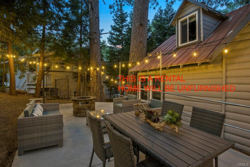 23882 Springwater Road Crestline, CA 92325 - Photo 33 of 39 a view of a patio with couches table and chairs and potted plants