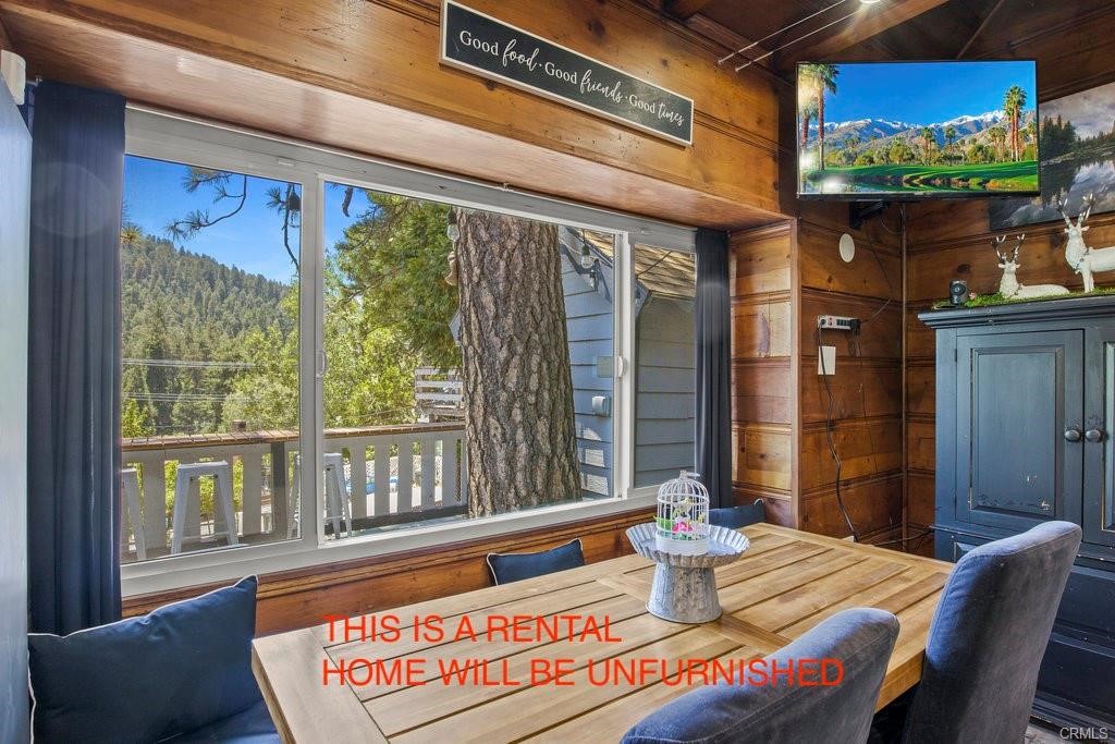 23882 Springwater Road Crestline, CA 92325 - Photo 6 of 39 a view of a dining room with furniture window and wooden floor