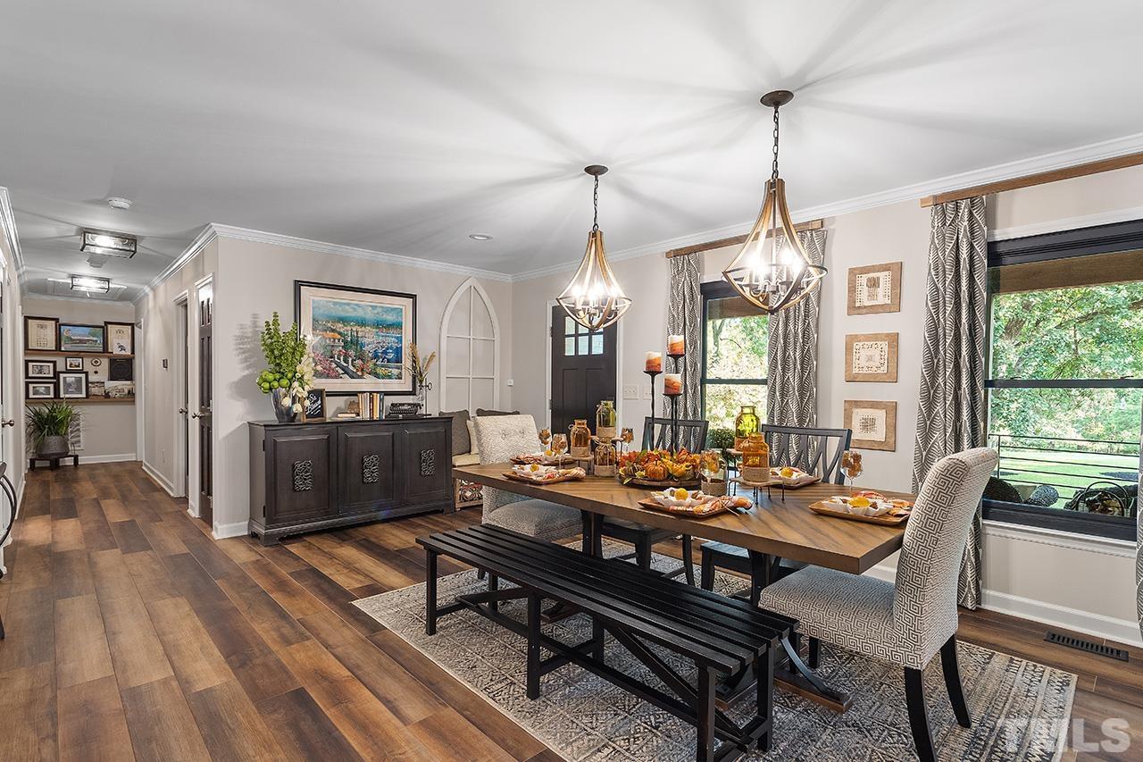 11605 Durant Road Raleigh, NC 27614 - Photo 11 of 42 a room with lots of furniture and a wooden floor