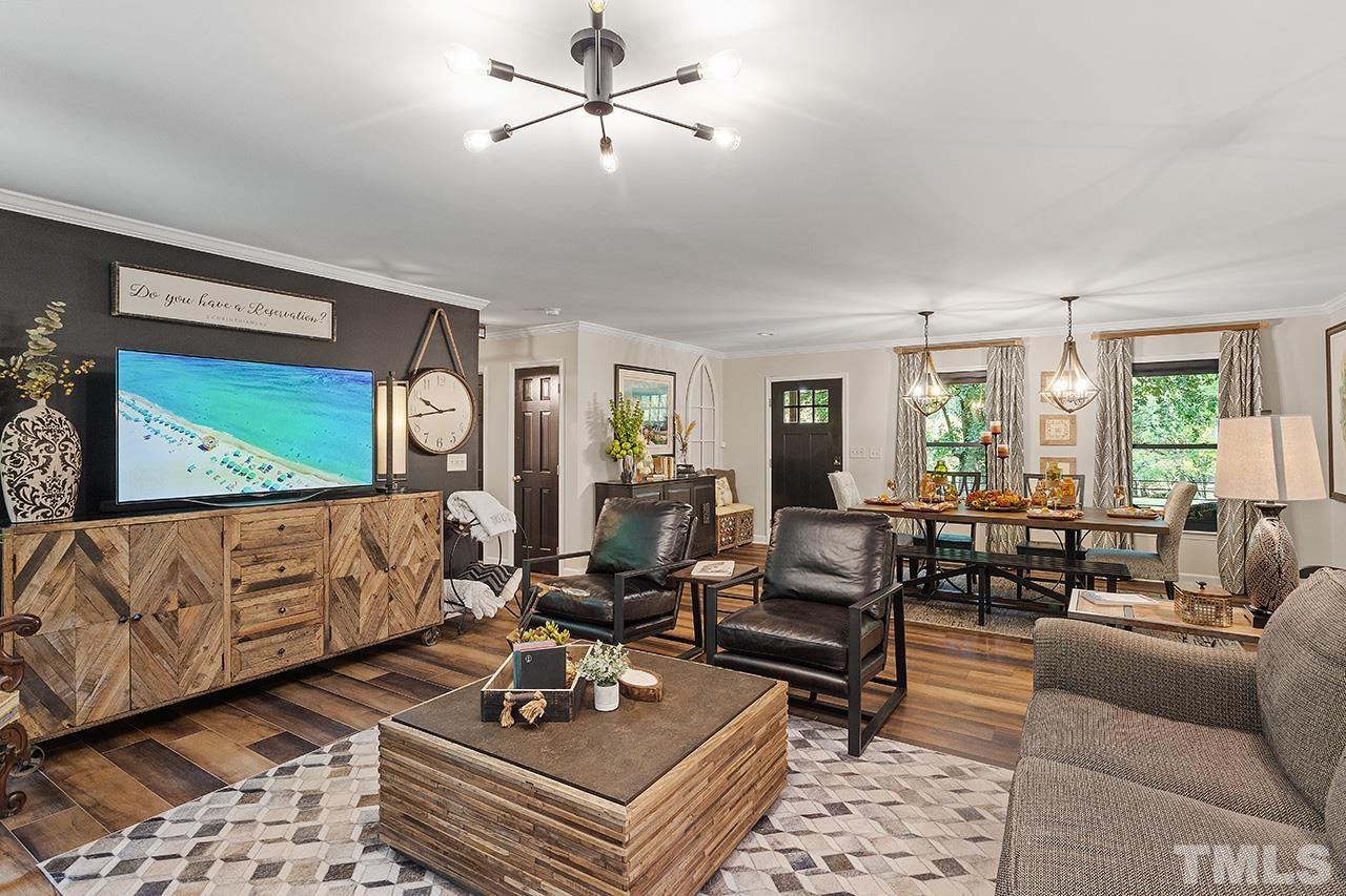 11605 Durant Road Raleigh, NC 27614 - Photo 12 of 42 a living room with furniture and wooden floor