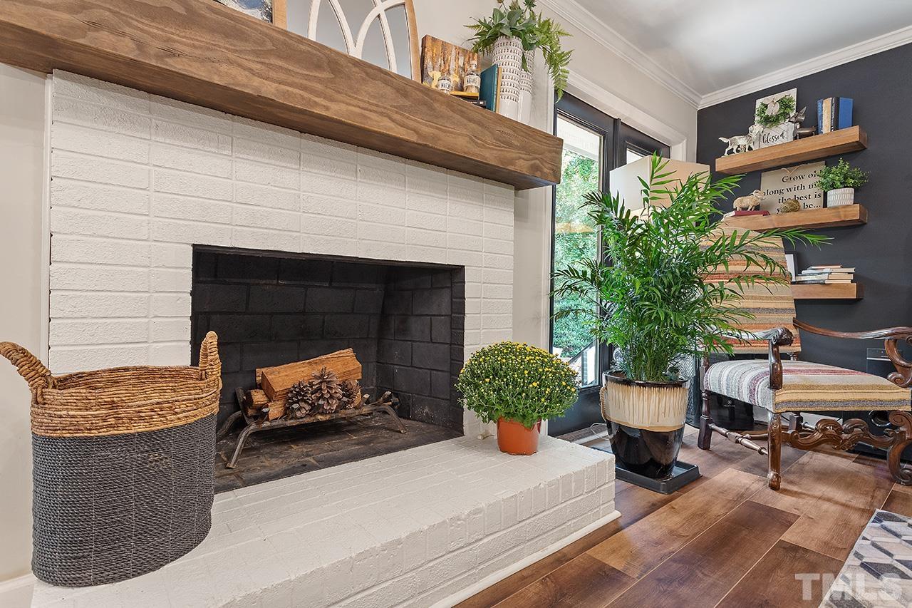 11605 Durant Road Raleigh, NC 27614 - Photo 13 of 42 a living room with furniture and a potted plant