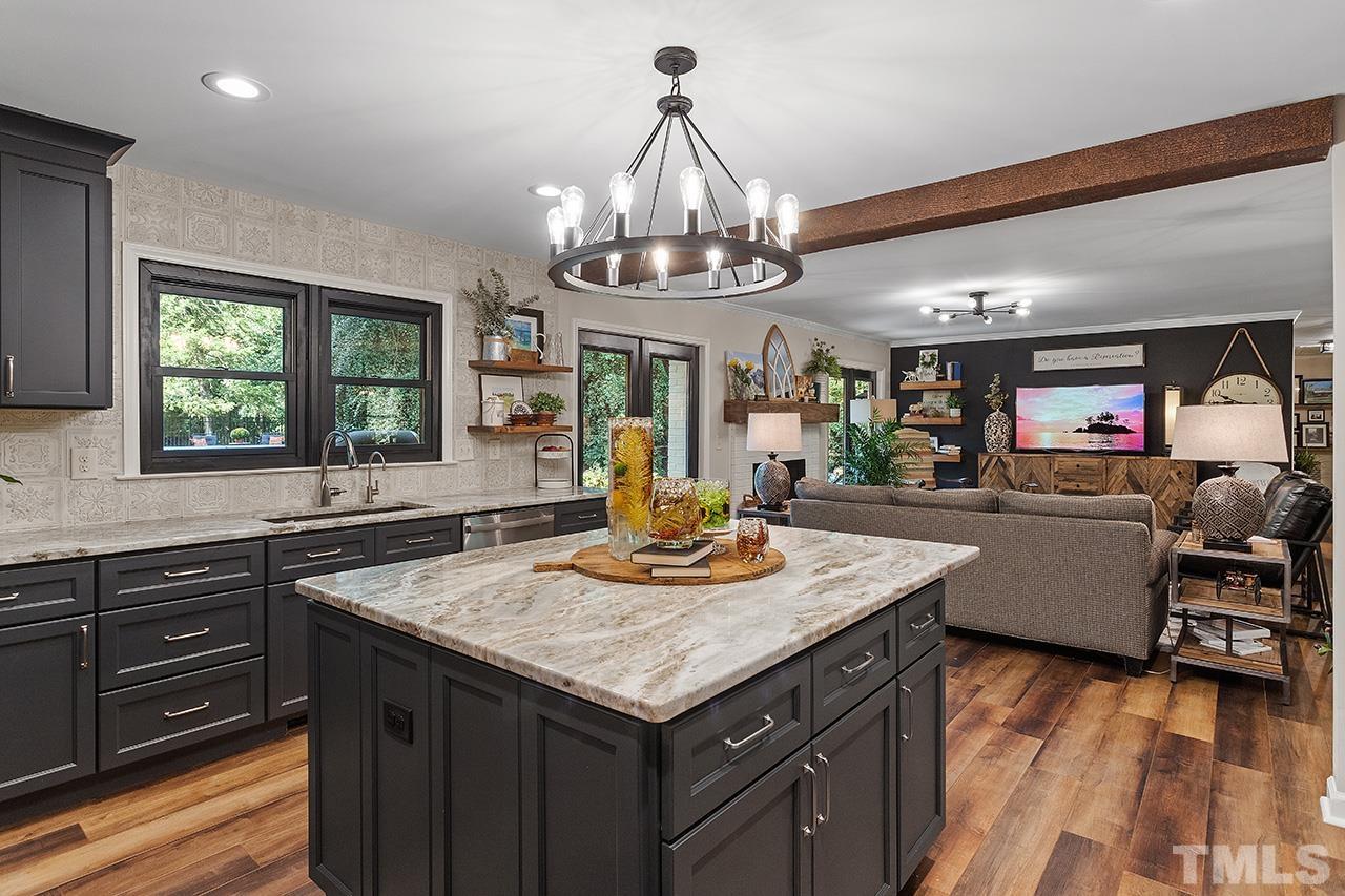 11605 Durant Road Raleigh, NC 27614 - Photo 15 of 42 a kitchen with stainless steel appliances granite countertop a kitchen island a stove and a sink