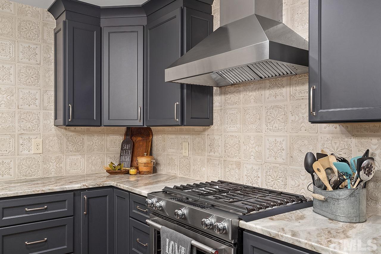 11605 Durant Road Raleigh, NC 27614 - Photo 17 of 42 a kitchen with a stove and cabinets