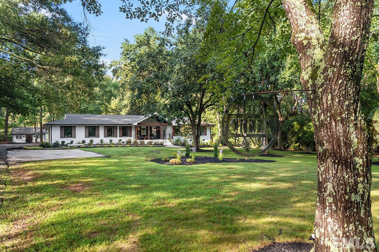 11605 Durant Road Raleigh, NC 27614 - Photo 2 of 42 a view of a swimming pool with a garden