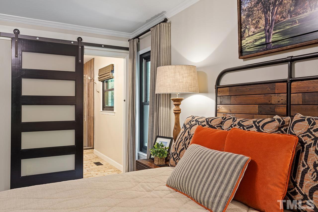 11605 Durant Road Raleigh, NC 27614 - Photo 22 of 42 a bedroom with furniture and a window