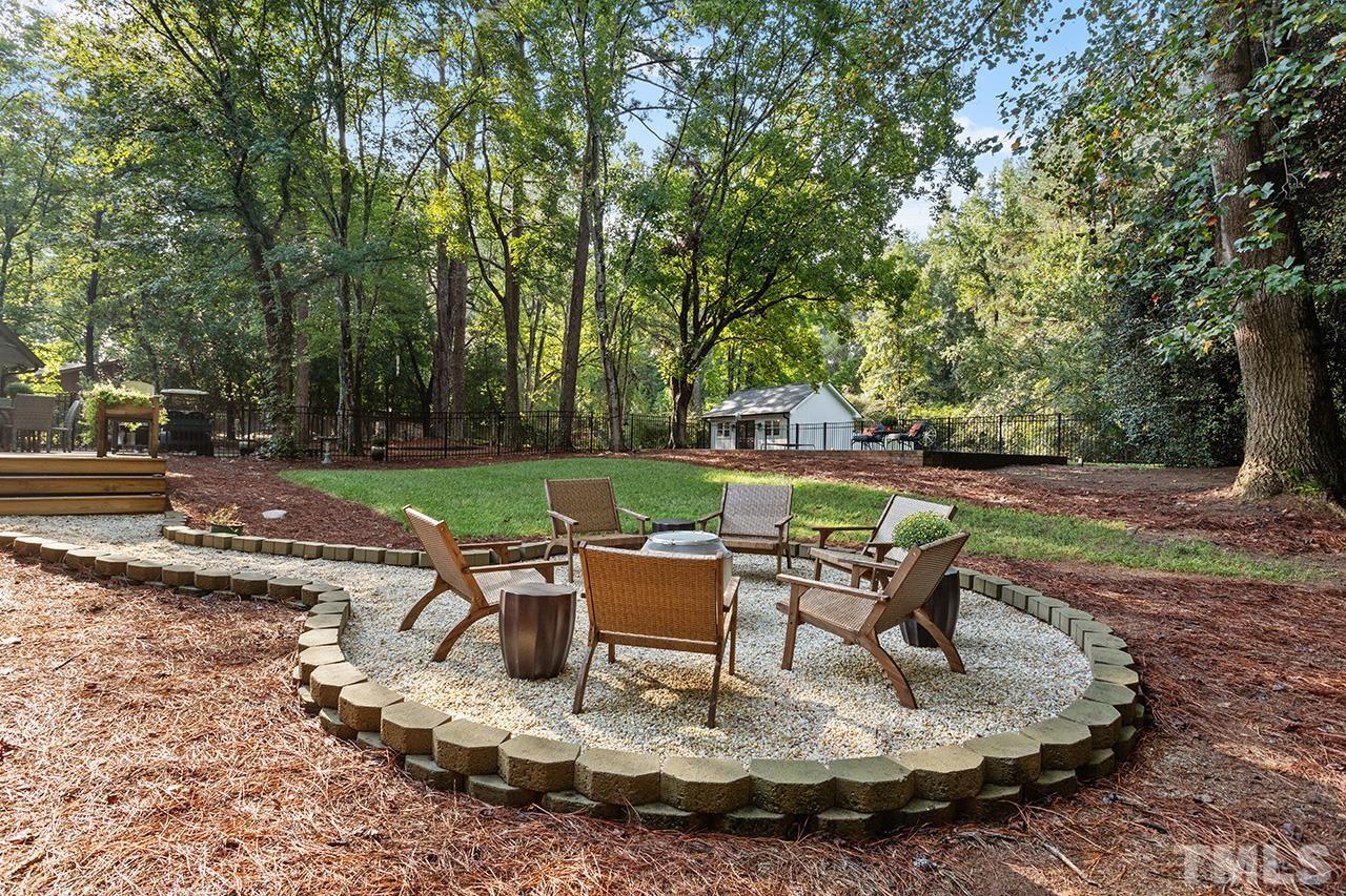 11605 Durant Road Raleigh, NC 27614 - Photo 35 of 42 a view of backyard with table and chairs